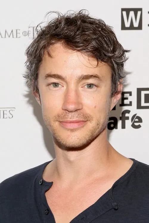 Tom Wisdom headshot